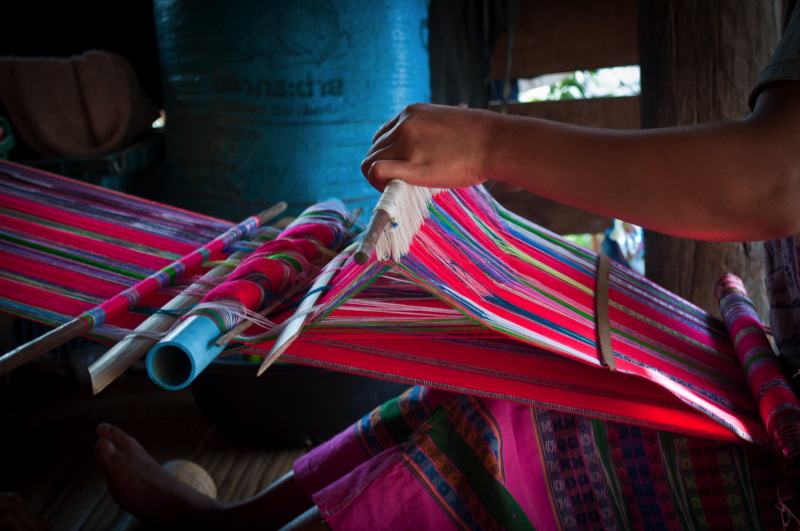 Pwo Karen artisan is weaving a cotton scarf